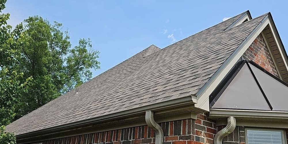 Brick home with a newly replaced shingle roof