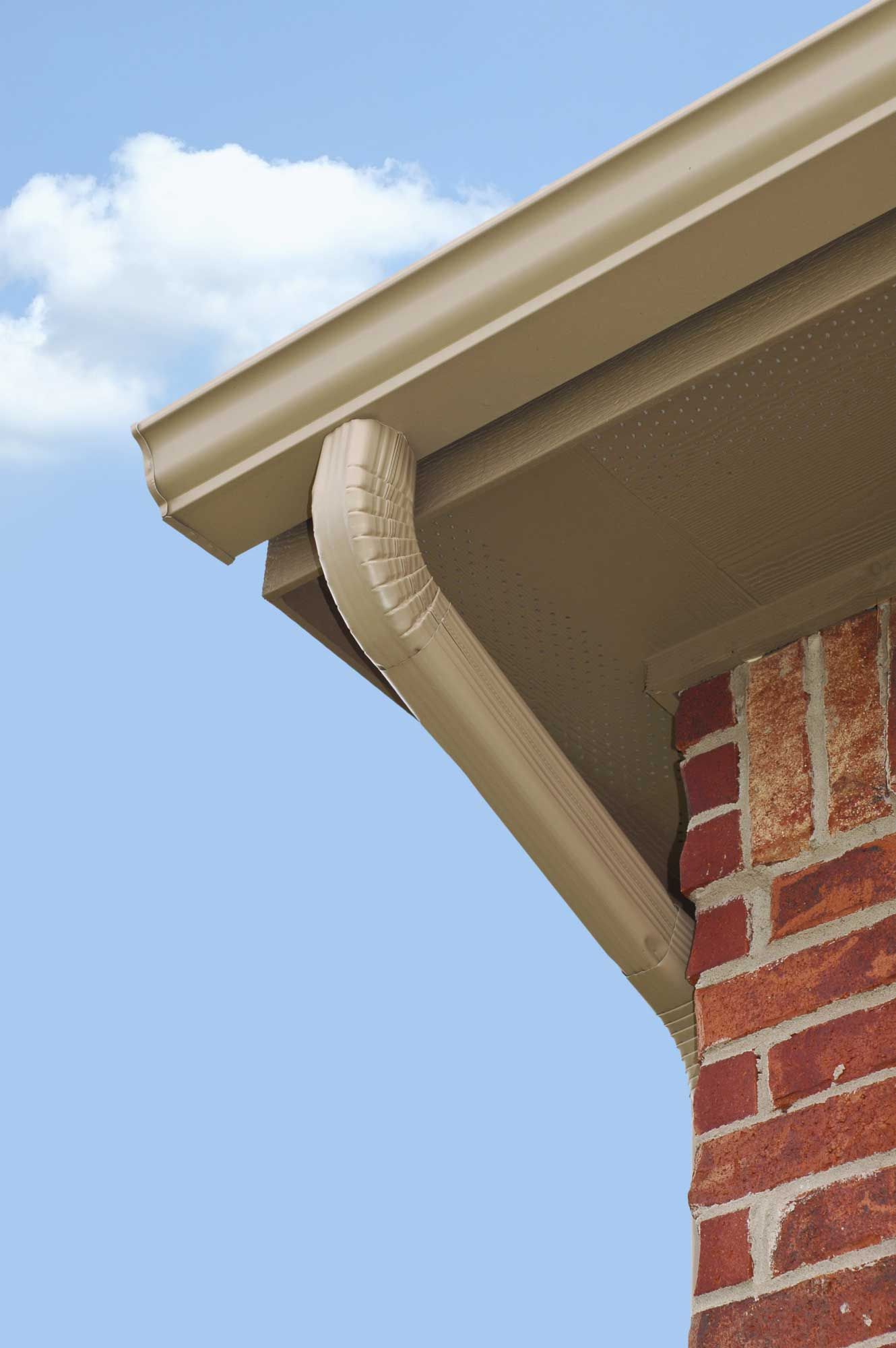 Gutter and fascia at the corner of a brick home