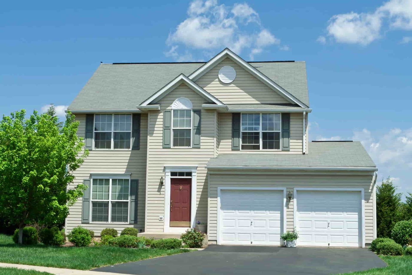 Comparing light and dark shingle colors on similar homes