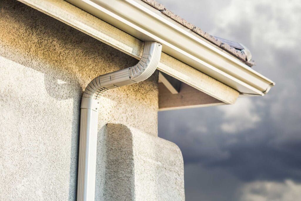 Seamless gutter and downspout on a home exterior