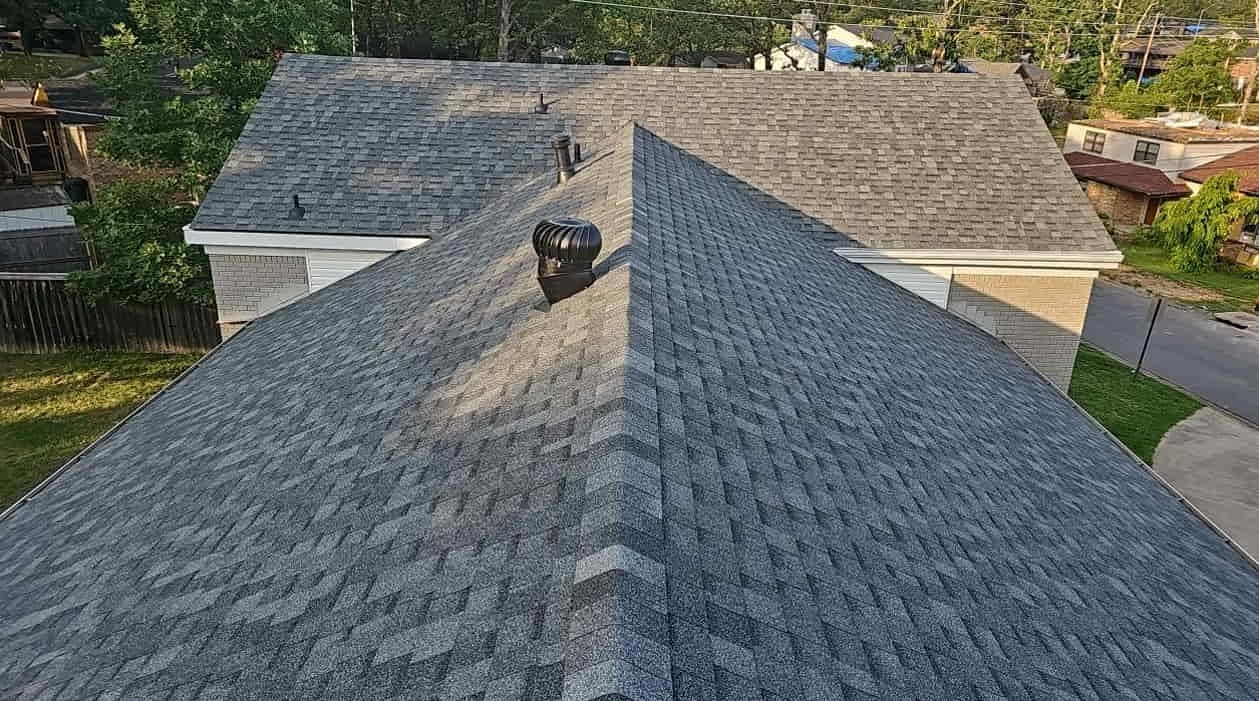 Aerial view of an impact-resistant shingle roof with ridge vents