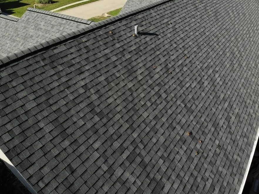 Close-up of impact-resistant asphalt shingles on a residential roof