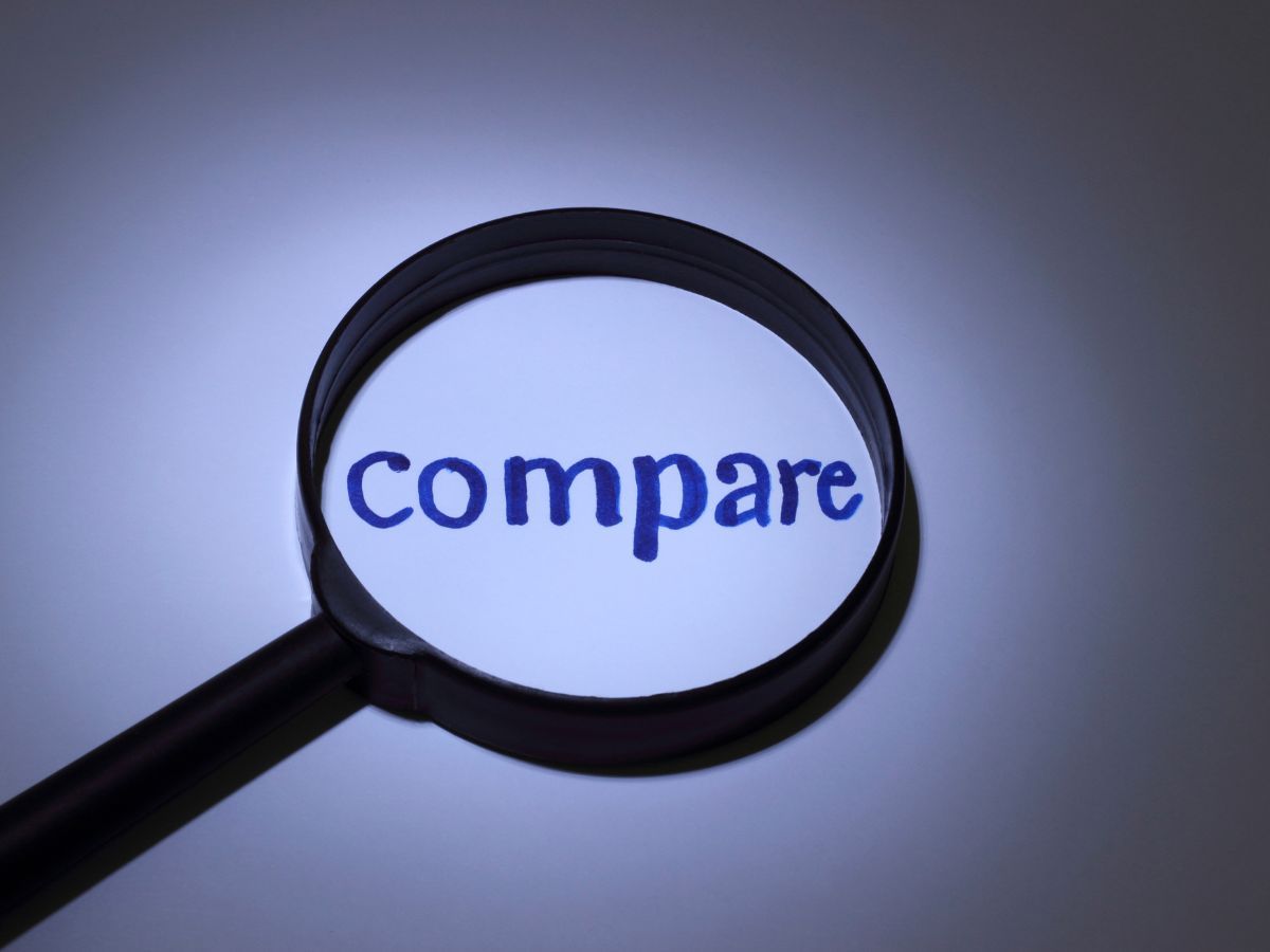 Magnifying glass over the word compare
