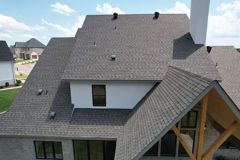 Newly installed architectural shingle roof on a two-storey home