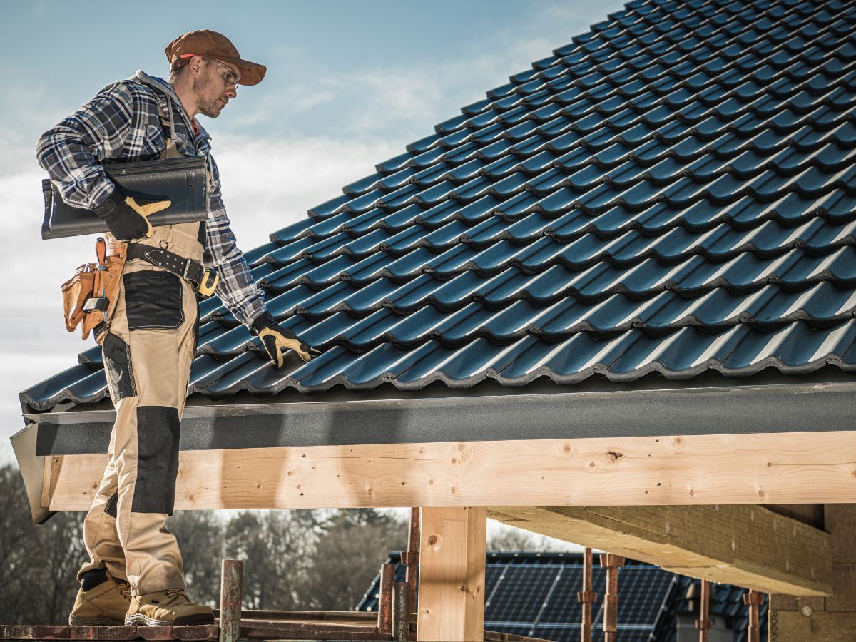 Roofer inspecting the roof edge for 3-tab shingles fit