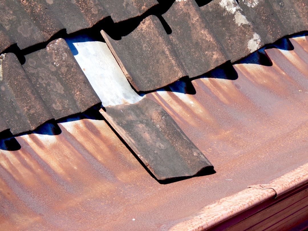 damaged shingles and roof flashing inspection