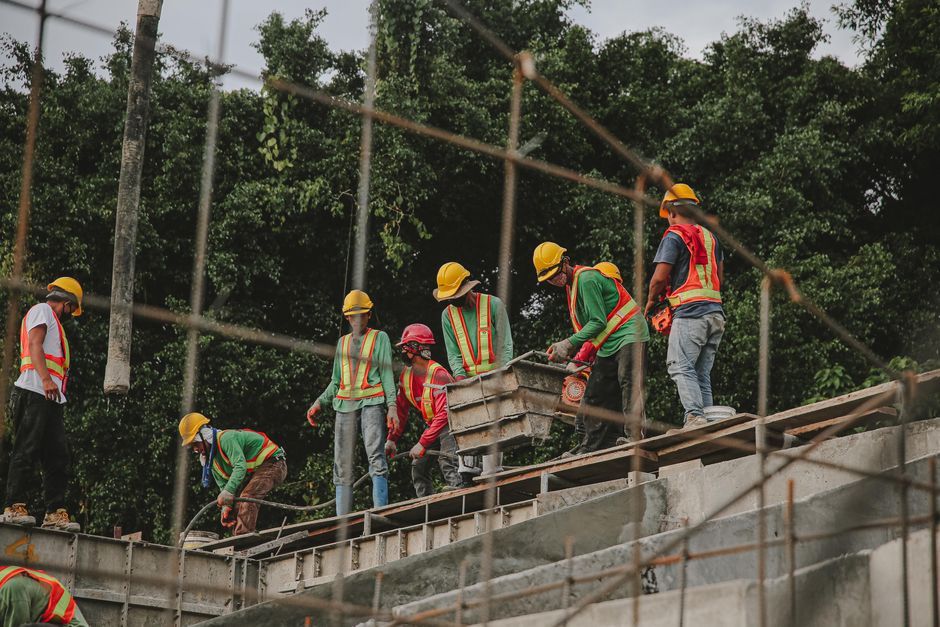 roofing crew working on a steep-pitched roof roofing crew working on a steep-pitched roof